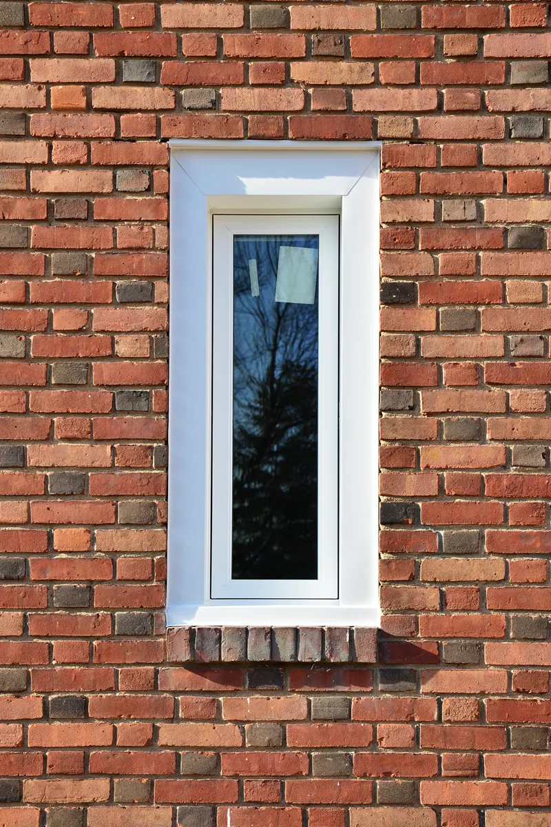 OKNA Narrow Bathroom Casement Window Installed In Brick SEVEN SUN CT