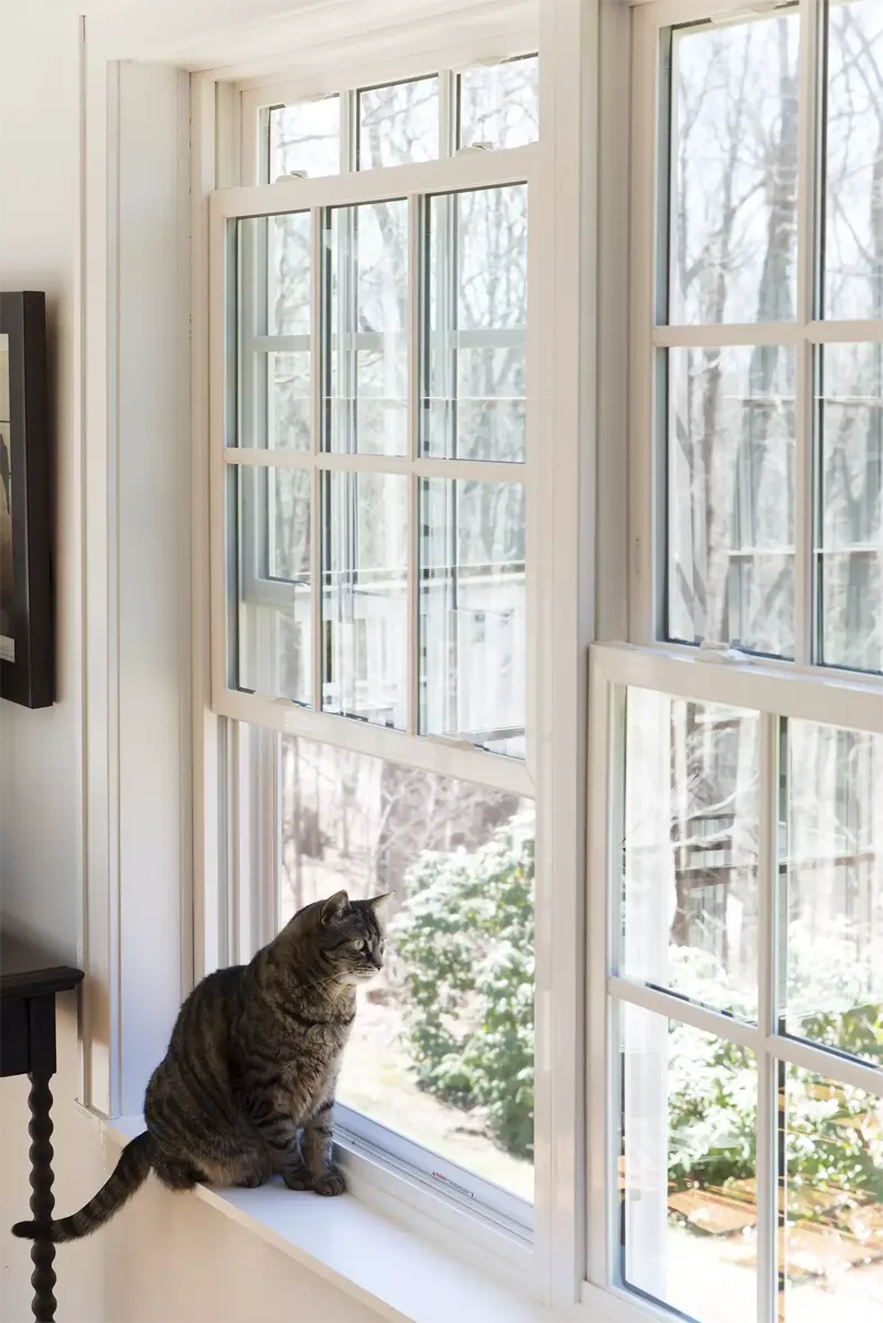 OKNA 800Series white double-hung window with full colonial grids Seven Sun CT