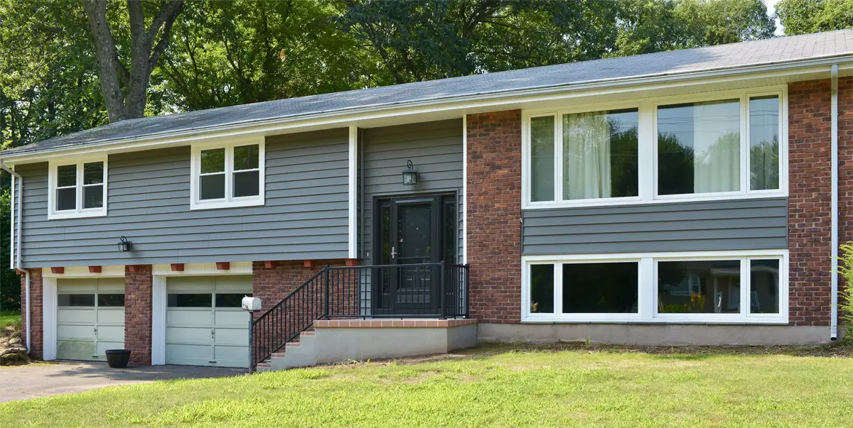 Okna casement and double-hung windows white exterior provia entry storm doors raised ranch house Seven Sun CT