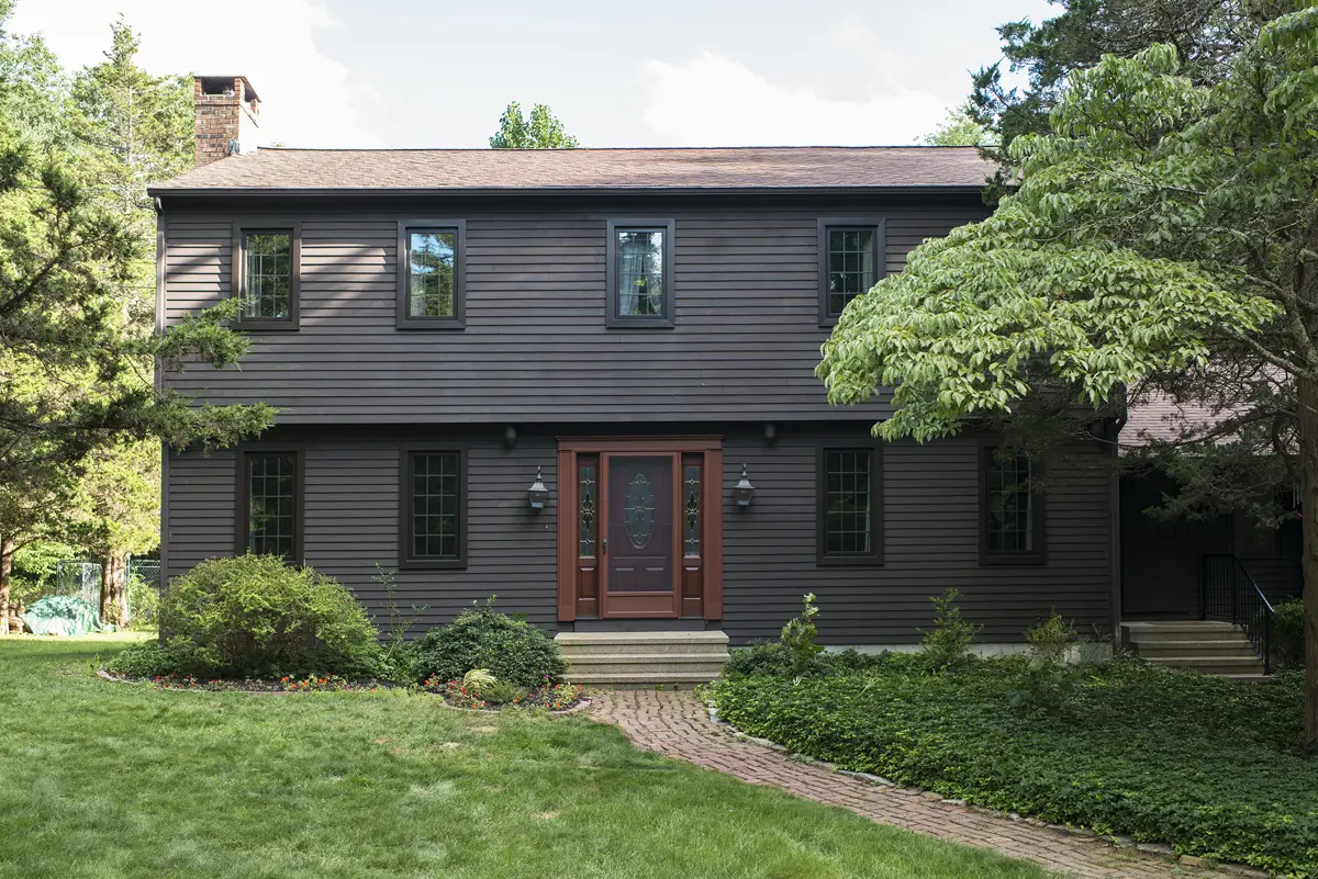 Okna casement windows_bronze exterior color colonial grids between glass raised ranch house front exterior view Seven Sun CT