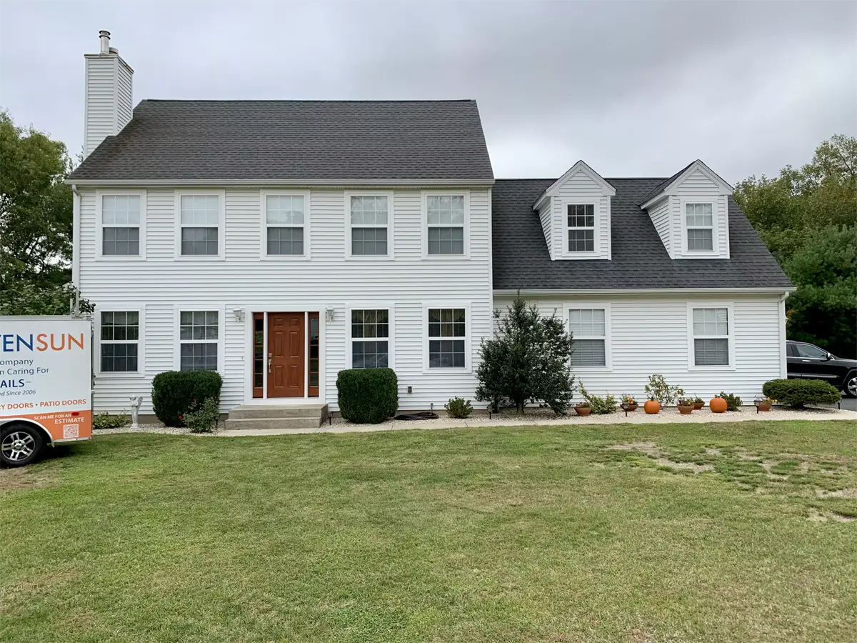 Provia signet entry front door with sidelites toffee stain colonial design sdl grids colonial home front view Seven Sun CT