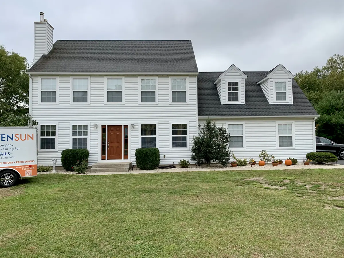 Provia signet entry front door with sidelites toffee stain colonial design sdl grids colonial home front view Seven Sun CT