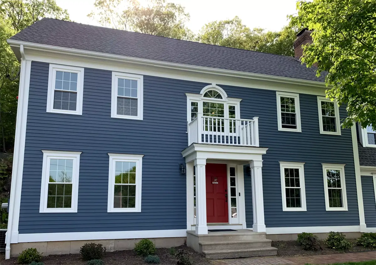 Okna envirostar 800 series white internal colonail grids beautiful colonial home blue siding front view Seven Sun CT
