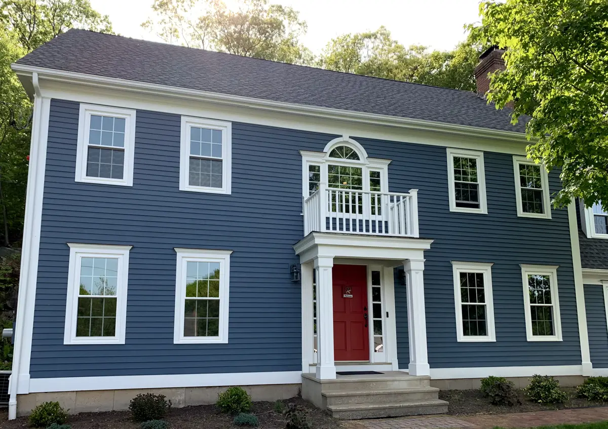 Okna envirostar 800 series white internal_colonail_grids beautiful colonial home blue siding front view Seven Sun CT