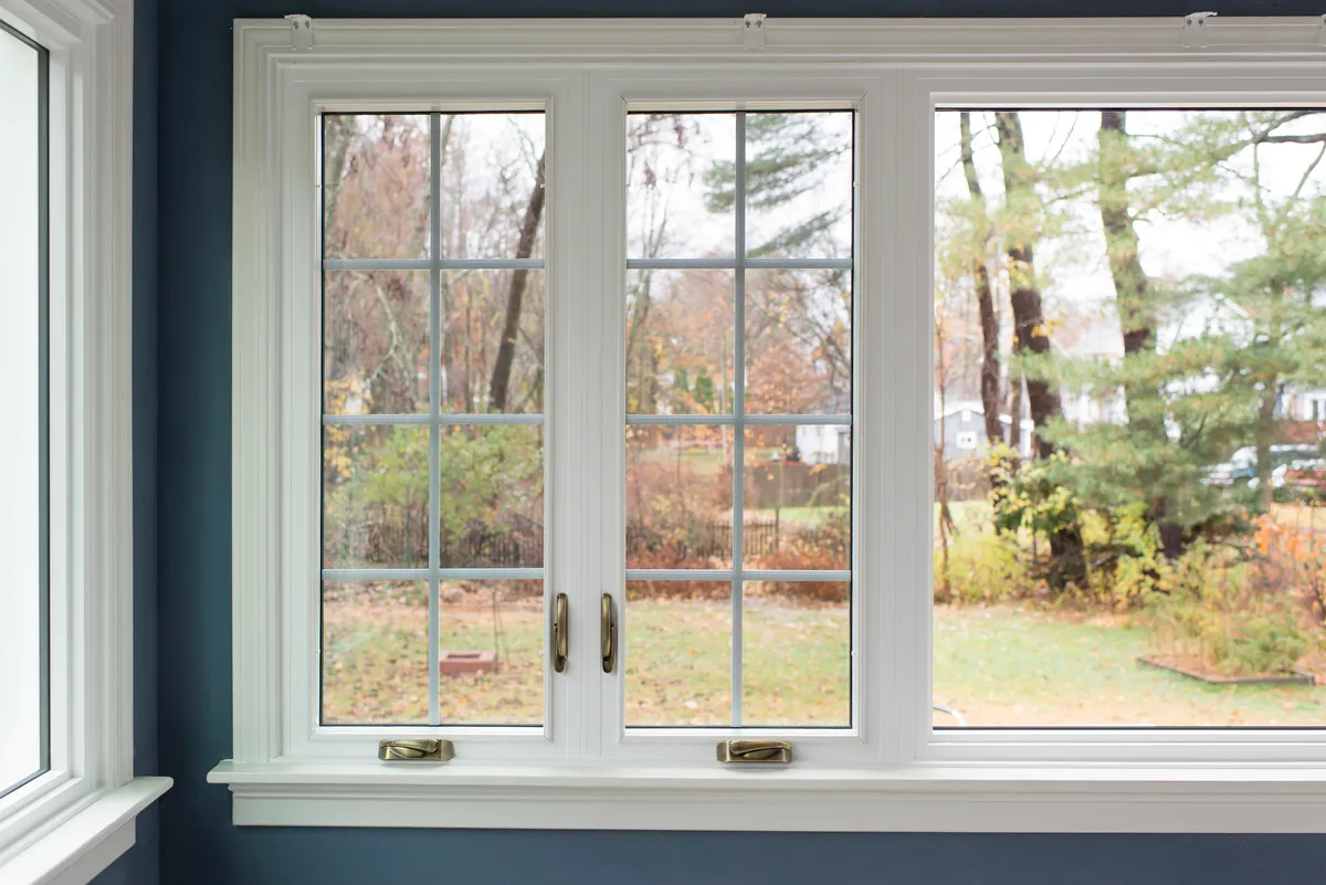 Living room window - double casement window, colonial grids, antique brass hardware - CT