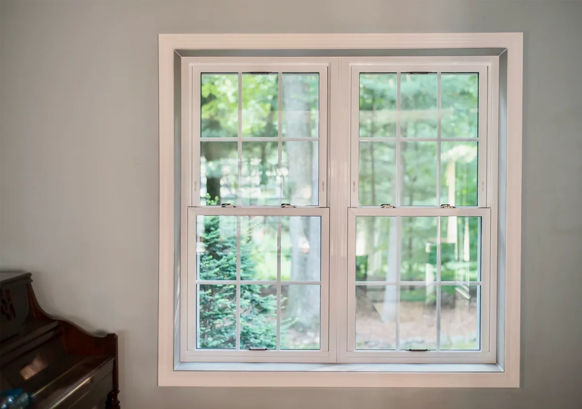 Living room window - twin double-hung window, full colonial grids, brushed nickle hardware - Okna CT